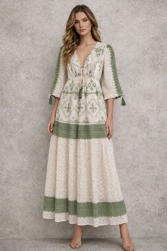 Maxi dress with sleeves, and embellishments.